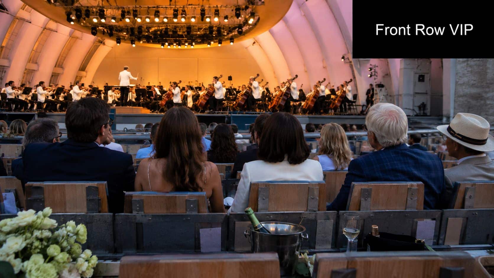 Audience members sit in premium outdoor seating during a live classical music concert at the Hollywood Bowl.