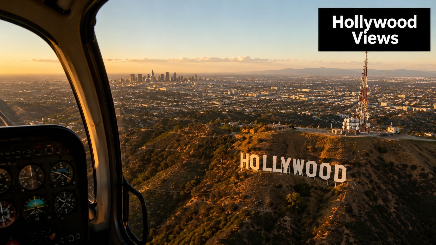 An aerial view from a helicopter cockpit overlooking the iconic Hollywood sign and the Los Angeles skyline.