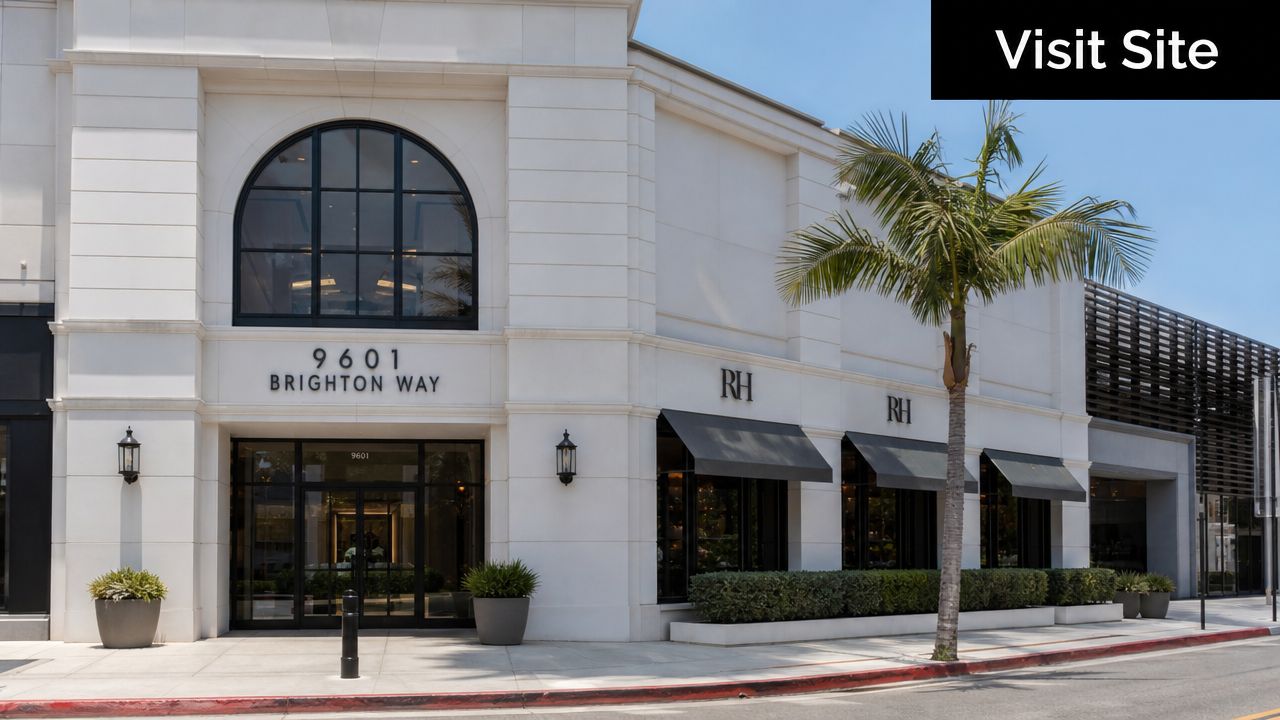 The exterior of a stylish white building located at 9601 Brighton Way in Beverly Hills.