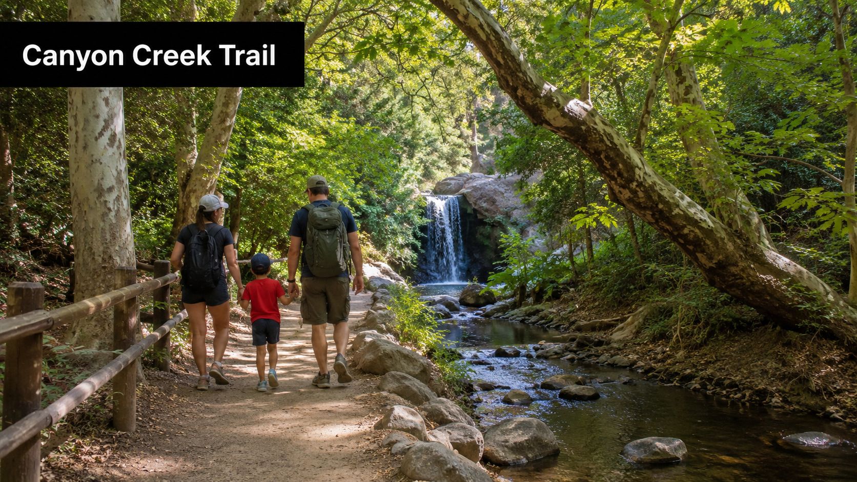 A family of three walking on the Canyon Creek Trail in San Diego toward a scenic waterfall.